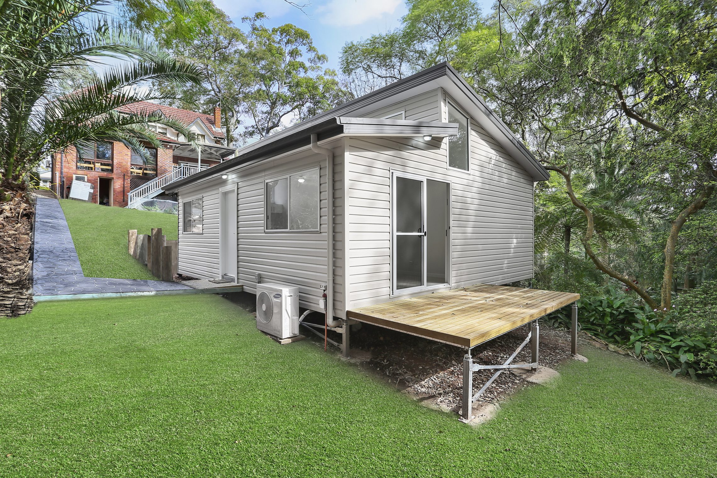 Granny flat on a slope with an elevated back deck