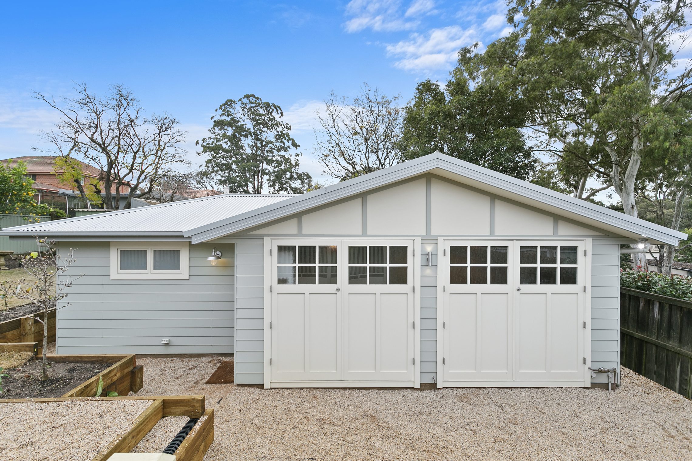 Granny flat with two large white barn door styled entry points