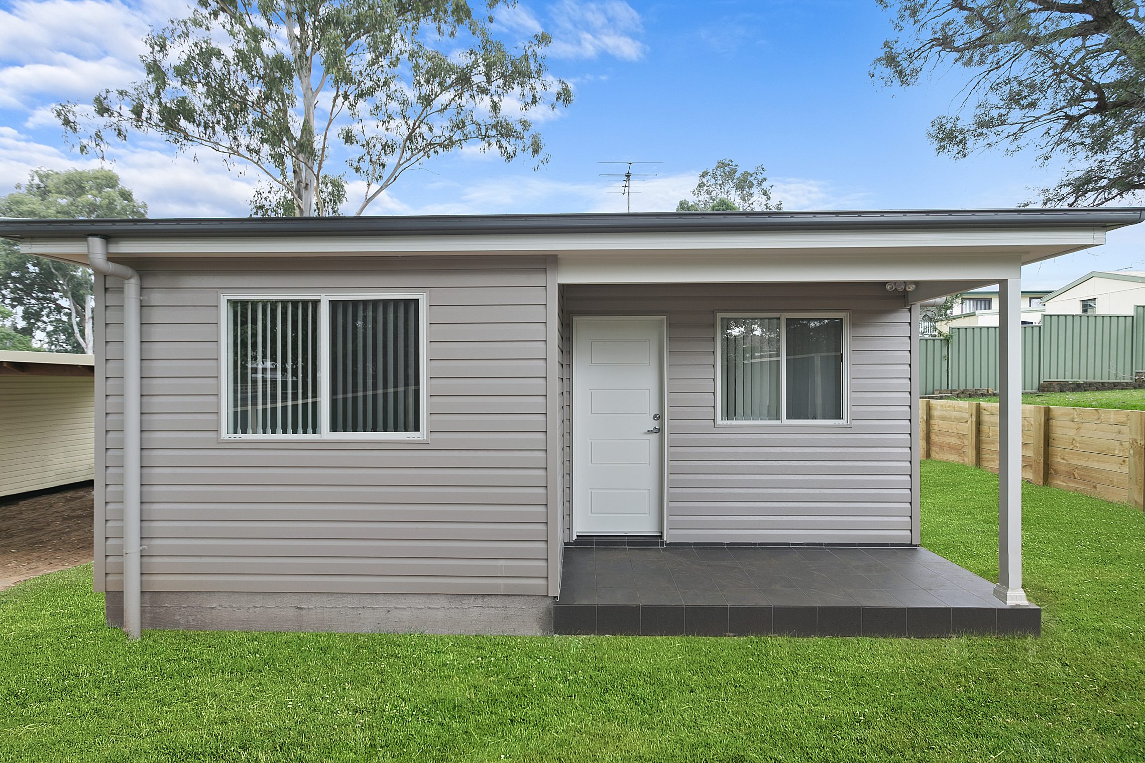 Small granny flat with covered patio outside of entry point