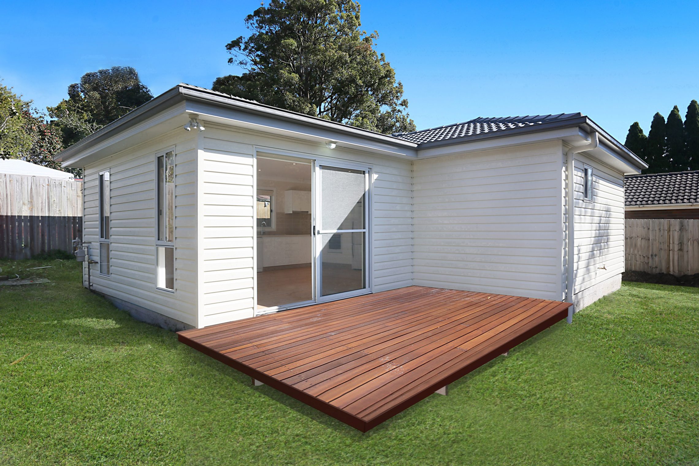 Sliding door entry to granny flat with wooden deck