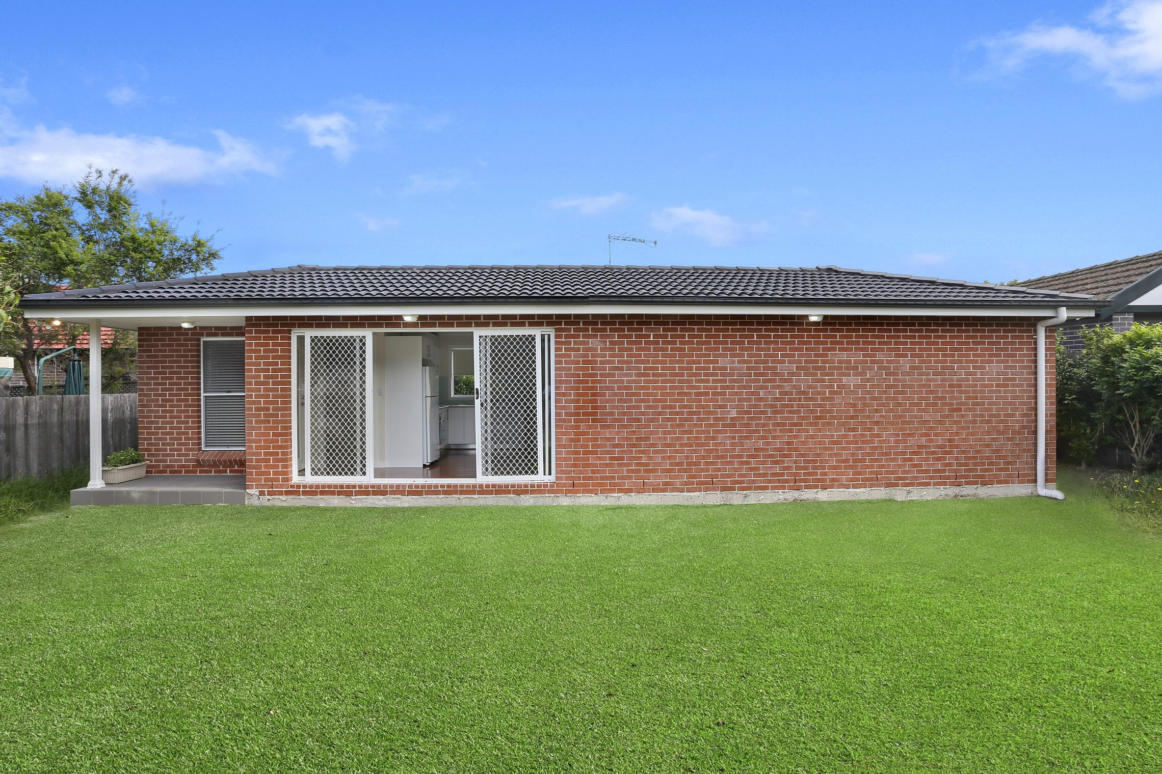 Sliding door entry to granny flat from lawn