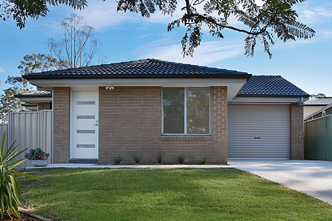 Brick granny flat with garage and driveway