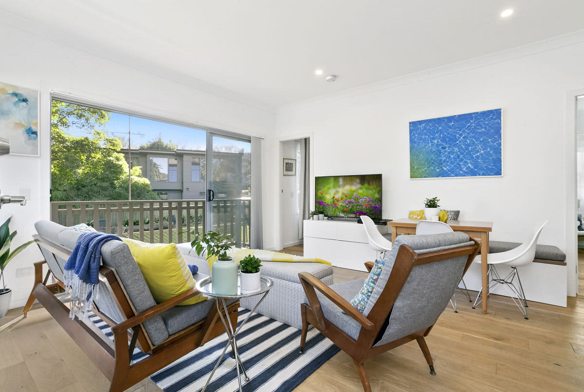 Living room with large sliding glass door and windows