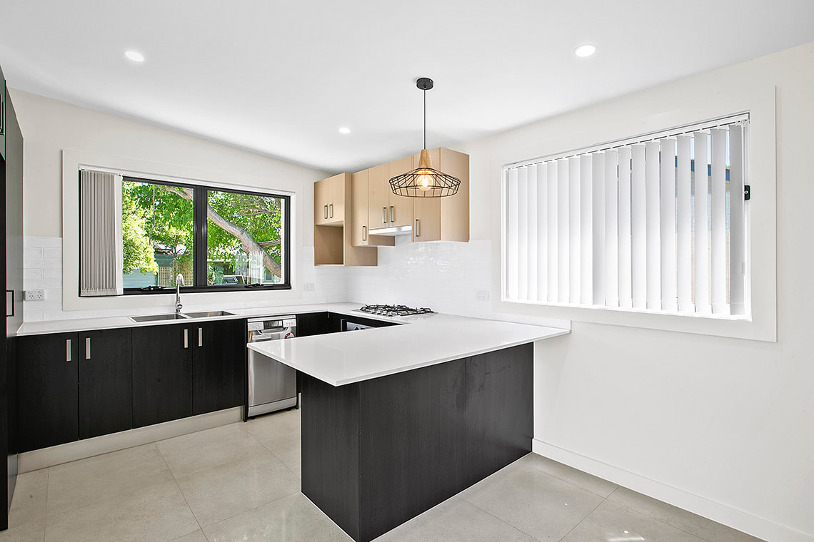 front of modern style granny flat kitchen in sydney