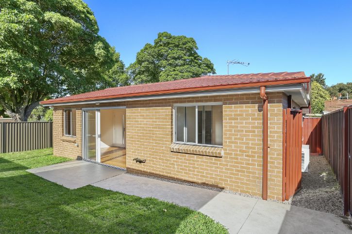 Outside of brick granny flat with wide doorway