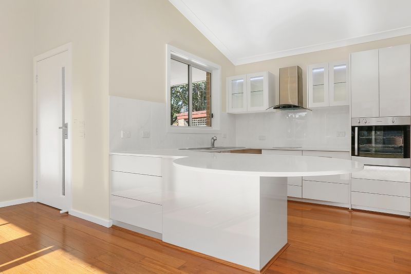 Wheelchair accessible kitchen with wood floors