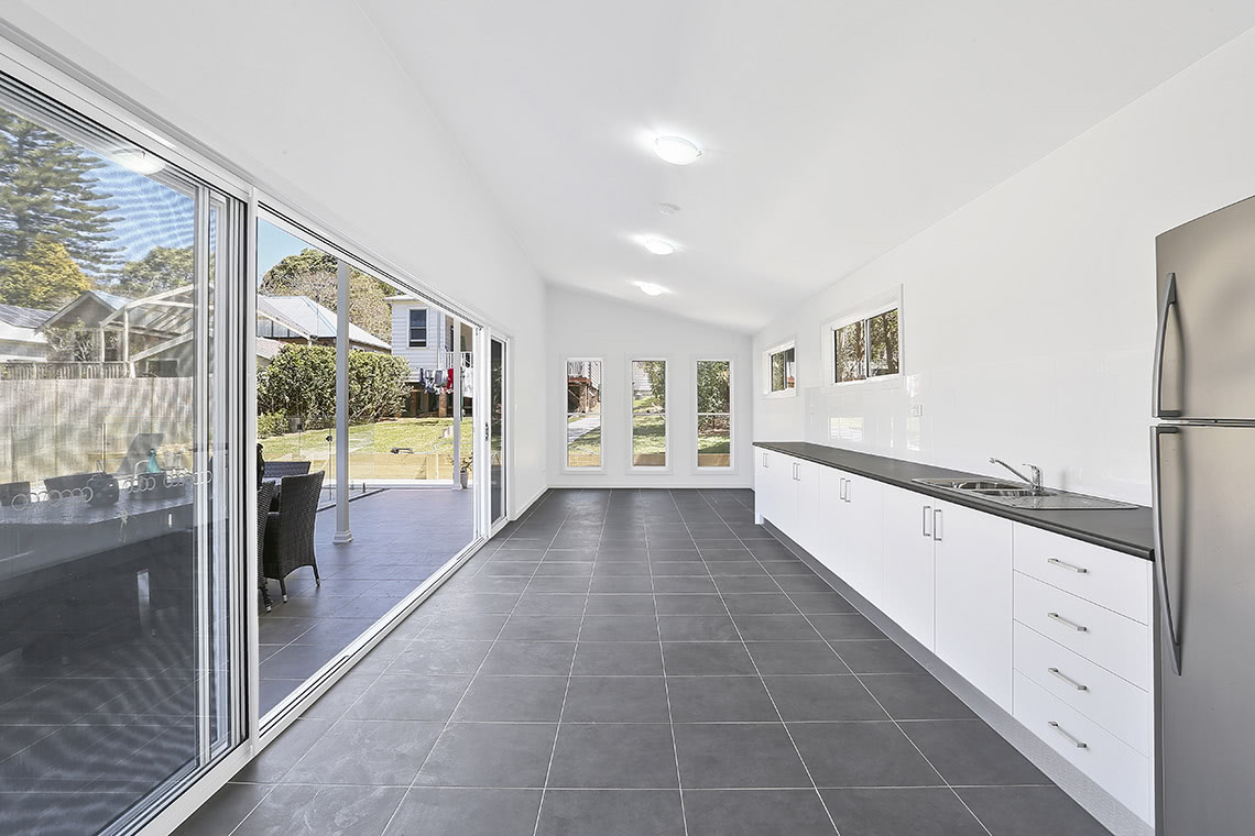 Granny flat kitchen with sloped roof